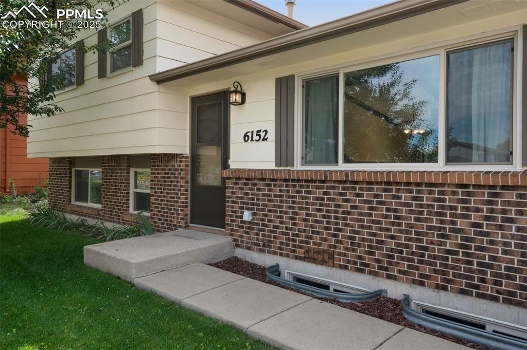 Image 31 of 49: Attractive brick front entry