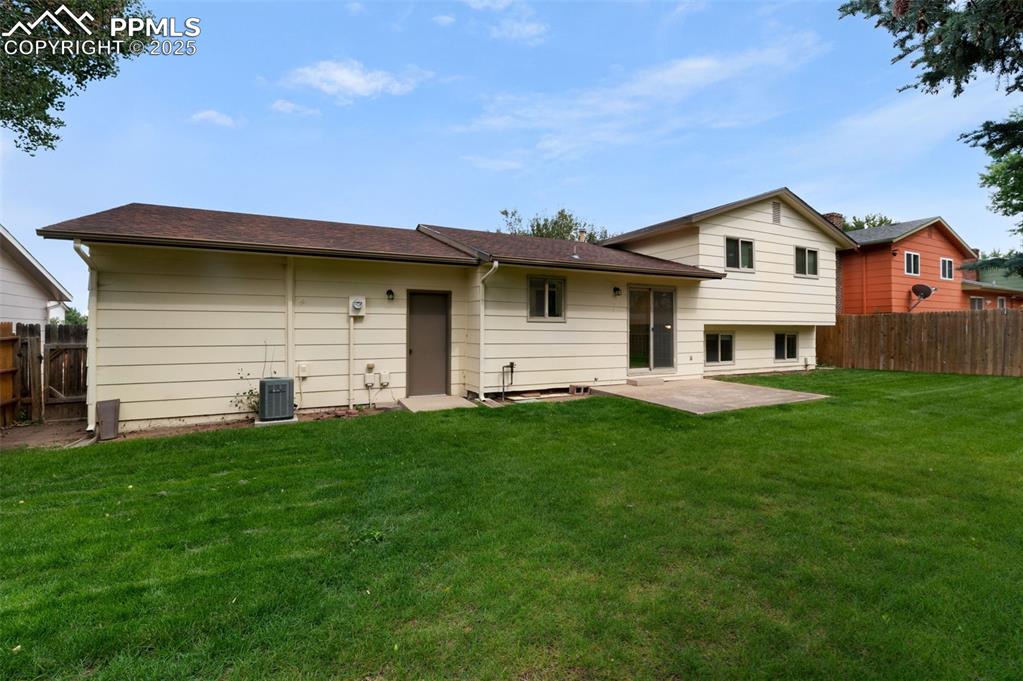 Image 34 of 49: Large Patio and nice back yard.