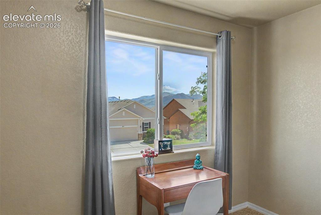 Image 29 of 42: Bedroom 2 with Pike Peak & Front Range Views