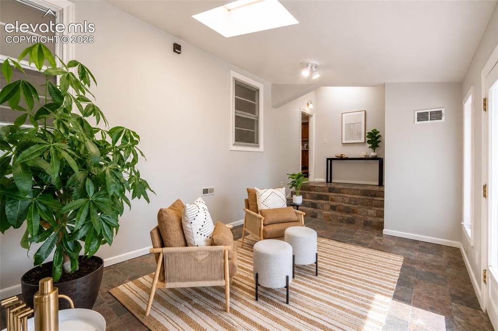 Image 26 of 50: Sun room with walkout to back yard and detached garage - main floor