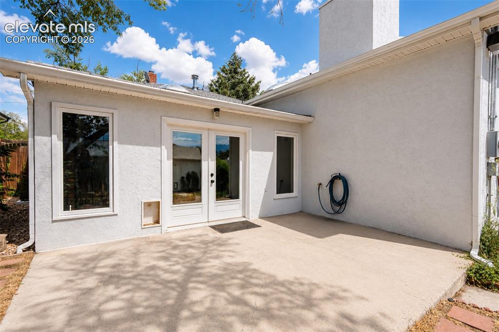 Image 28 of 50: Sun room with walkout to back yard and detached garage - main floor