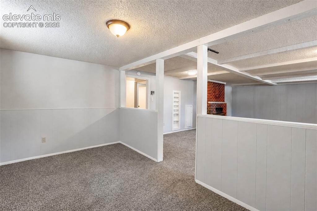 Image 34 of 50: Second living room/future bar/play/flex room - basement