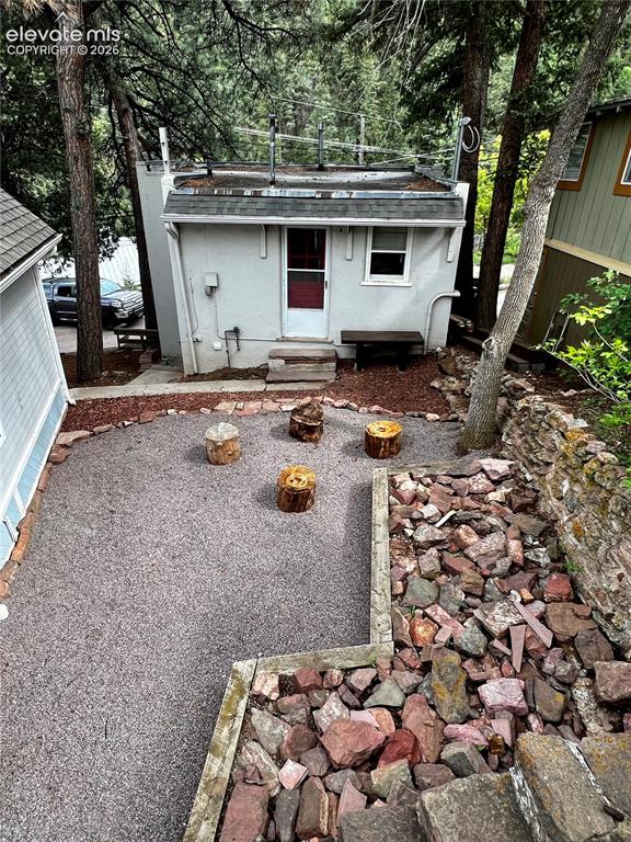Image 23 of 45: Upper Apt: View from patio to the upper unit. The exterior entrance to the 