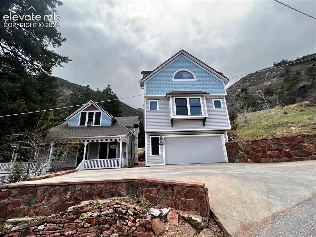 Image 3 of 45: Custom Built Cottage on Right: 2 bd/1ba with new driveway addition allows