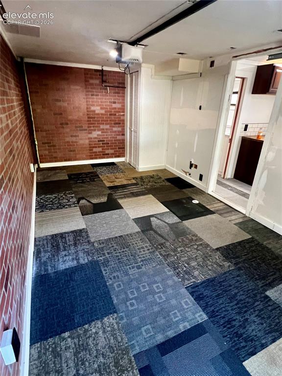 Image 31 of 45: Lower Apt: Garageis heated. Initially built to be an optional bedroom.