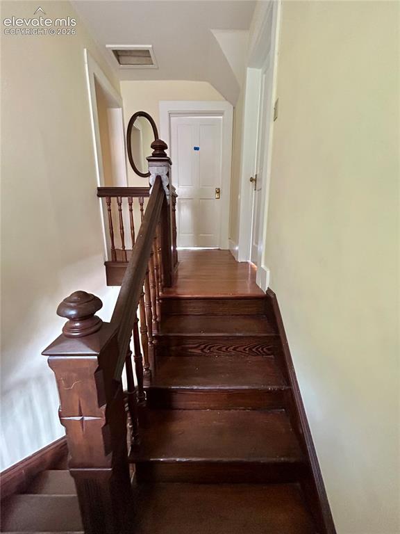Image 39 of 45: Main House/602: Beautiful stairs lead to the upstairs bedrooms and bath
