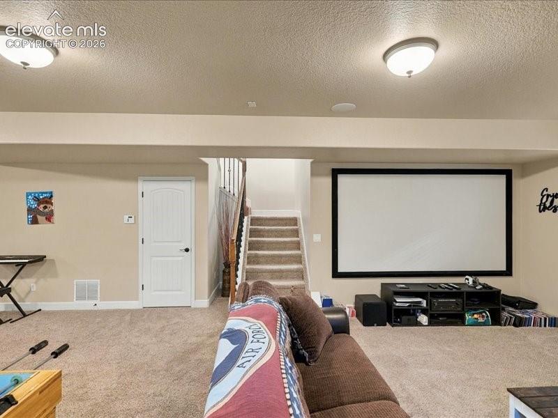 Image 45 of 50: Built-in projection screen, recessed ceiling lighting, carpeted flooring, p