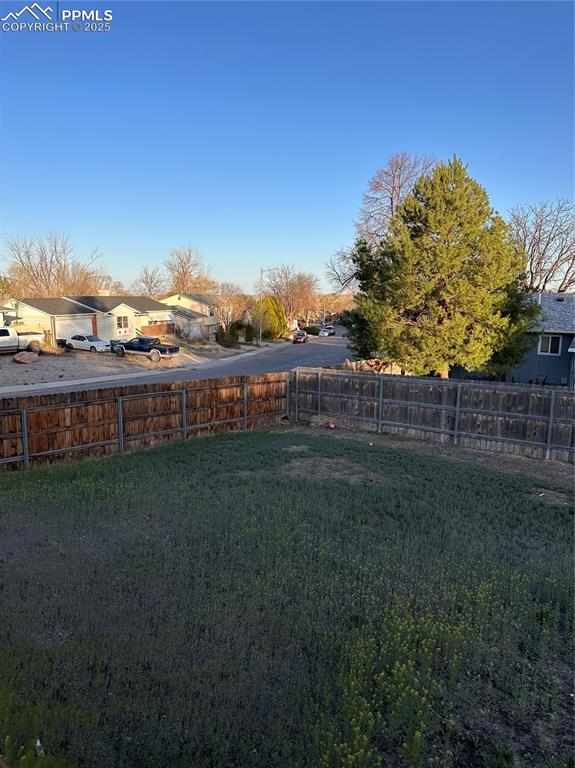 Image 18 of 23: View of yard with fence