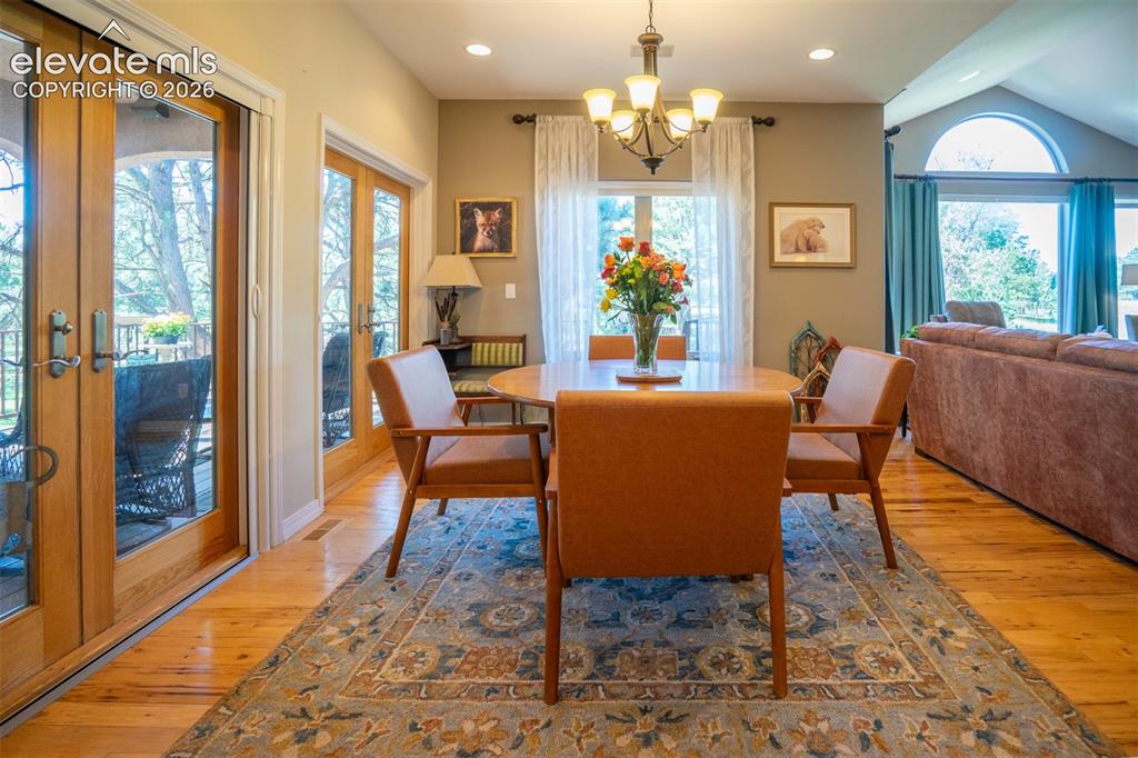 Image 10 of 50: The Dining area is off the living rm and opens to 2 Pella Brand French door