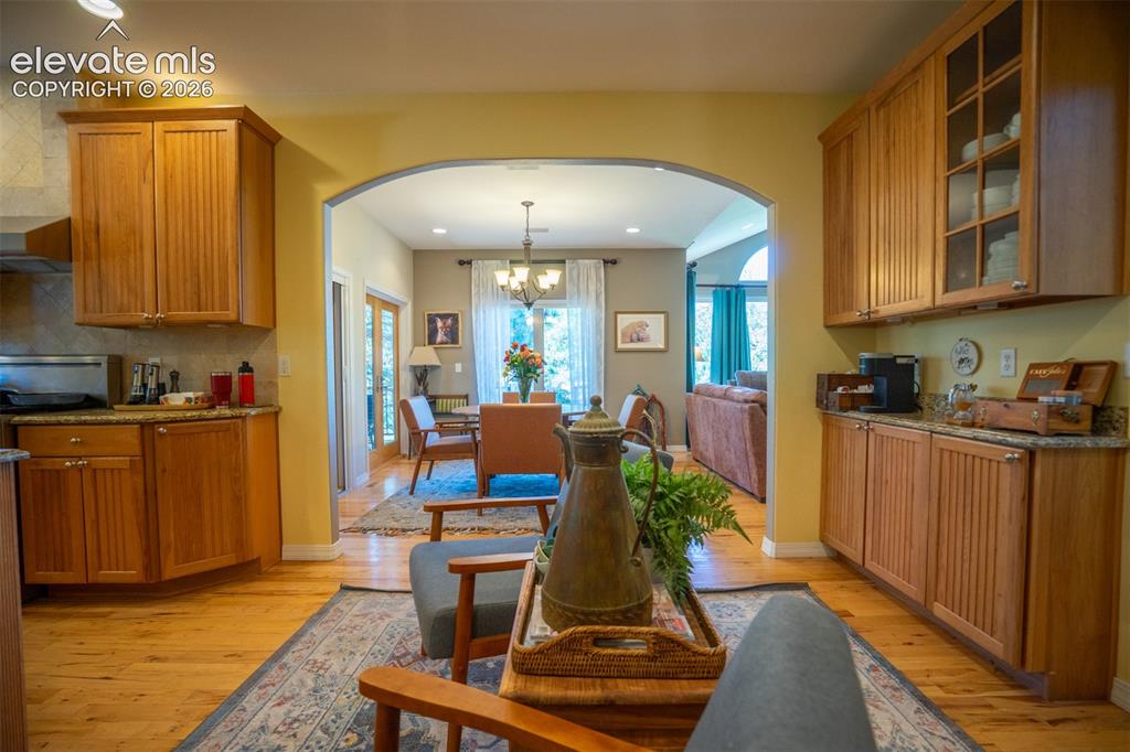 Image 14 of 50: Every kitchen needs its own coffee bar! This one is tucked into the casual 