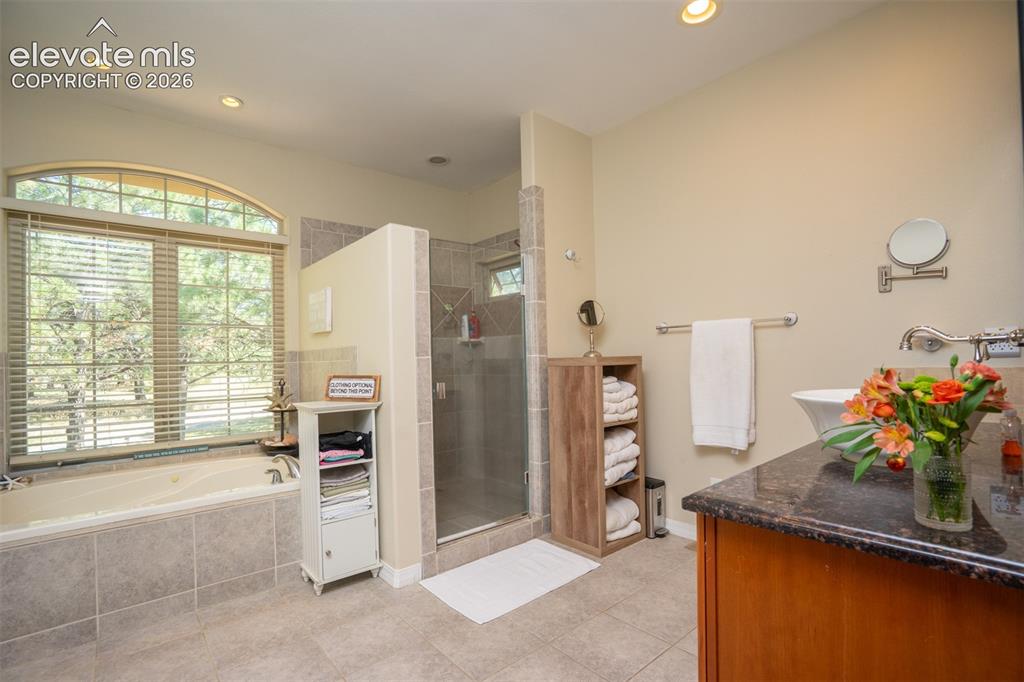 Image 17 of 50: Need a little pampering? This Primary bath offers 2 separate sinks, a jette
