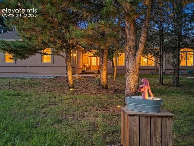 Image 2 of 49: Welcome home to this lovely property filled with pine trees throughout.