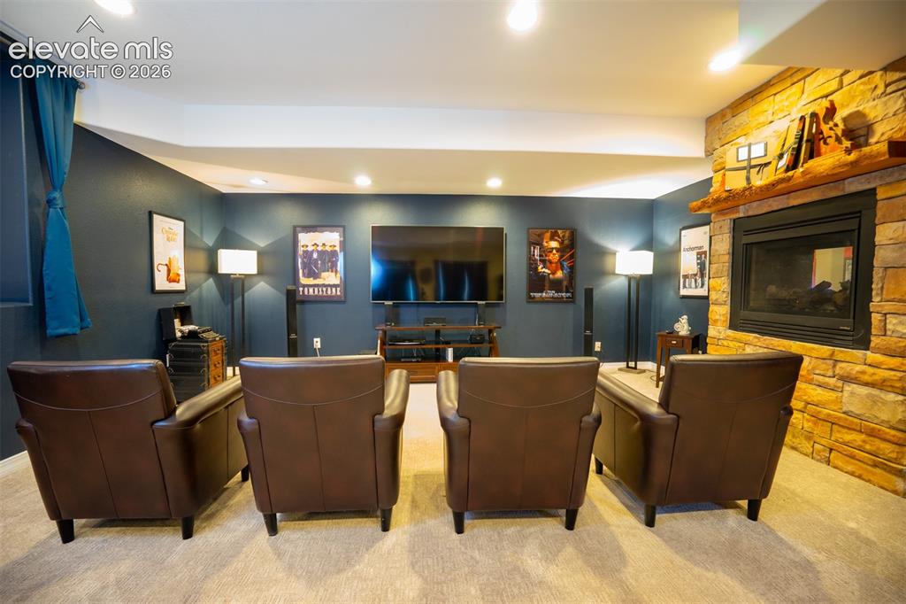 Image 28 of 50: Head down to the basement for the home within a home. Enjoy a theater setti