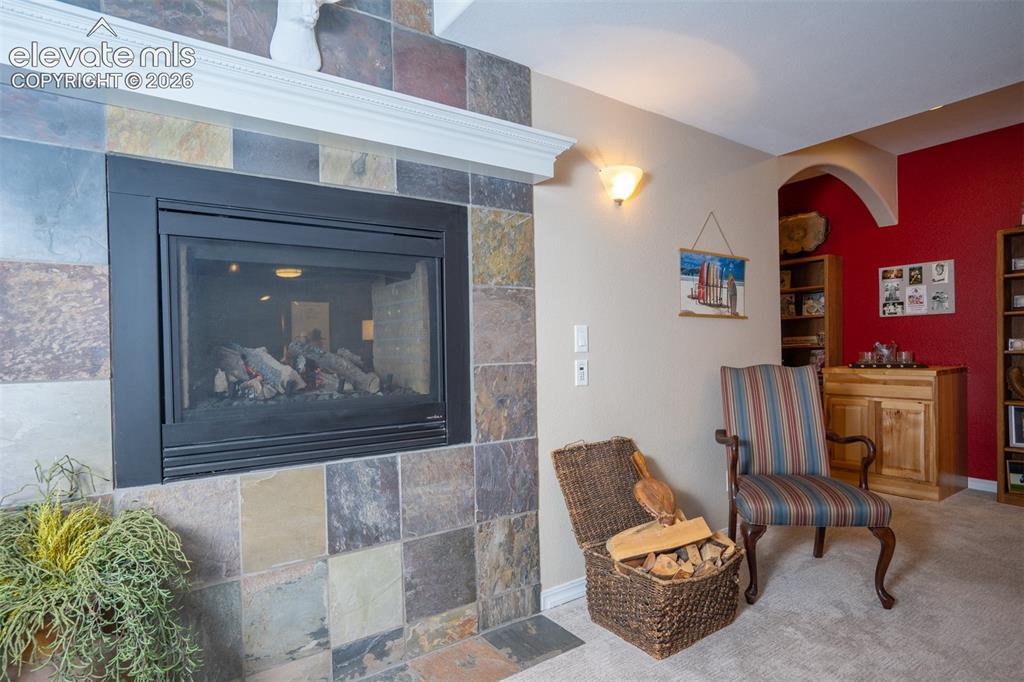 Image 30 of 50: The other side of the two-way fireplace between the dining and living room 