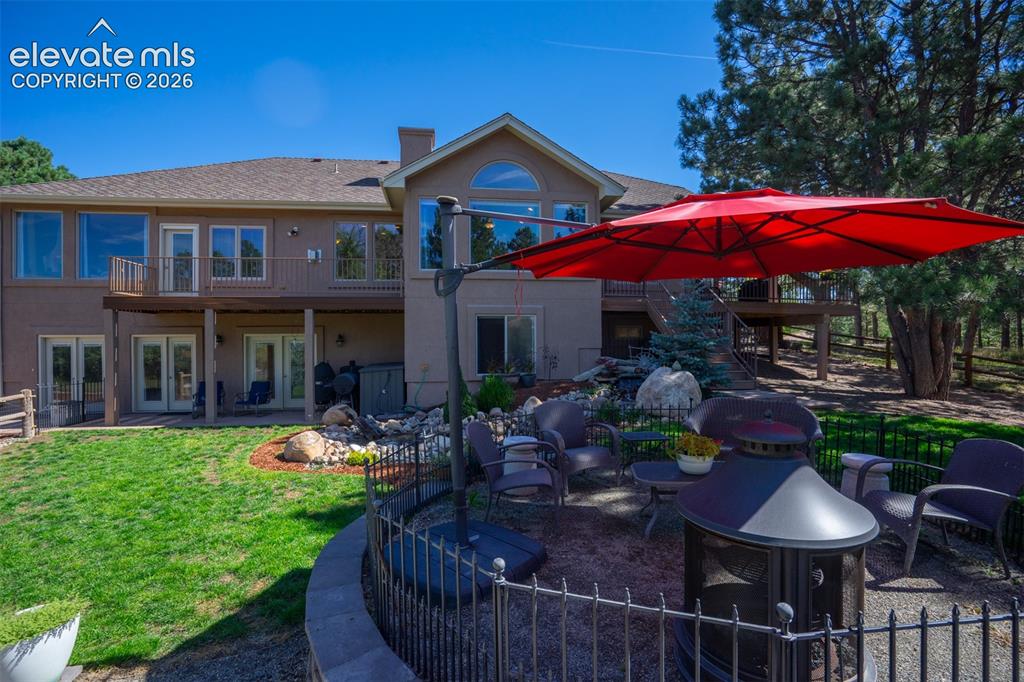 Image 40 of 50: There are multiple patio spaces for gathering friends and family. This one 