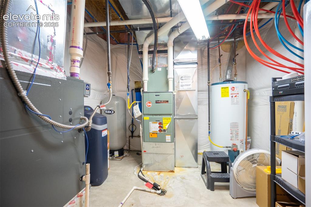 Image 46 of 50: This is the mechanical room. 2 furnaces serve both the upstairs and a 2nd f