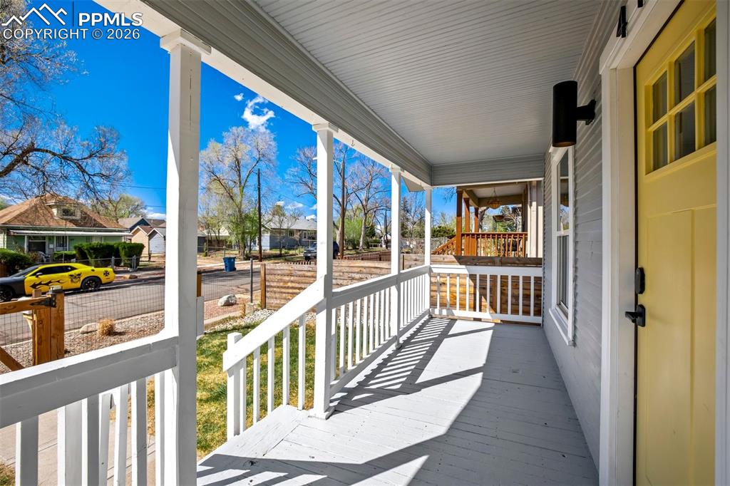Image 3 of 36: Front area is also fenced in so that Fido can enjoy the porch too.
