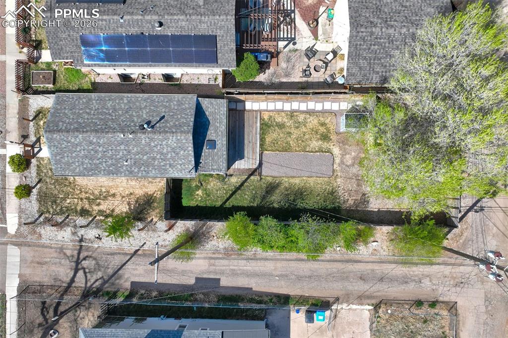 Image 33 of 36: Great backyard space with ally access.