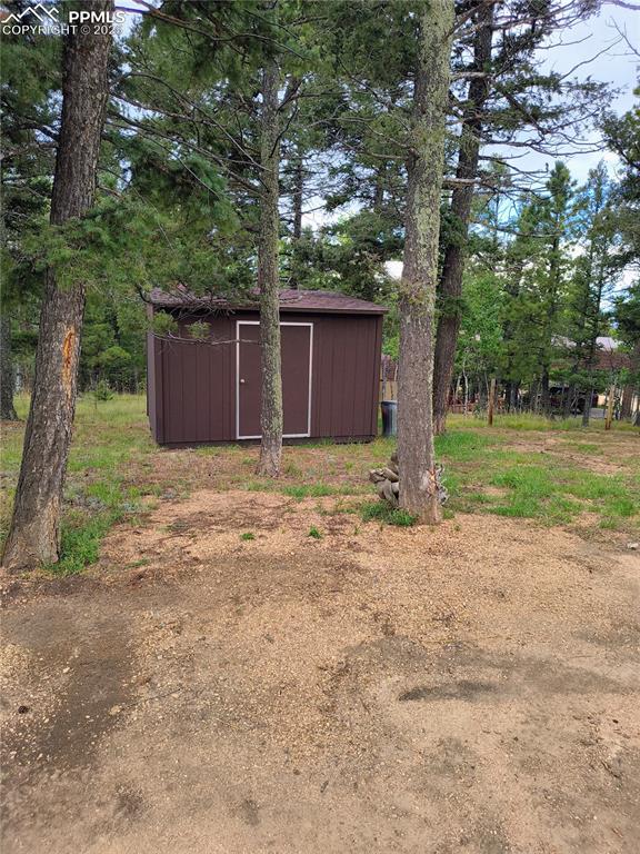 Image 8 of 20: View of yard with a storage shed