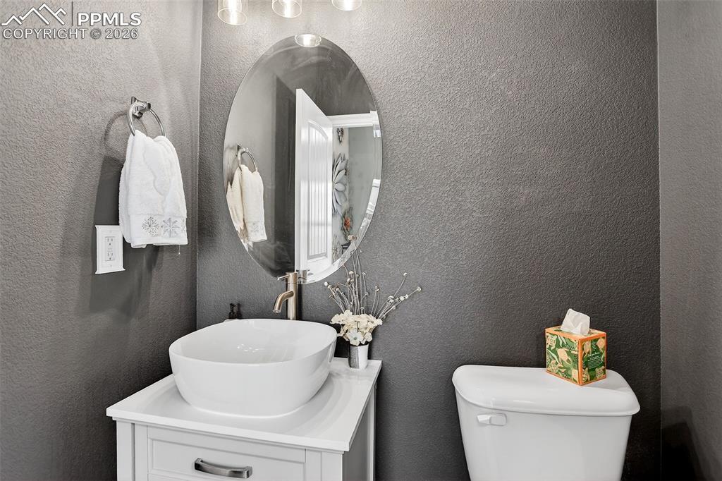 Image 12 of 34: Powder bath off foyer