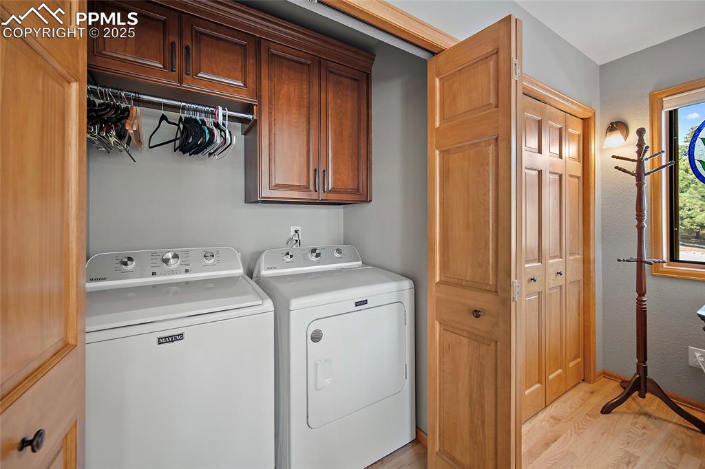 Image 18 of 49: Primary bedroom private laundry