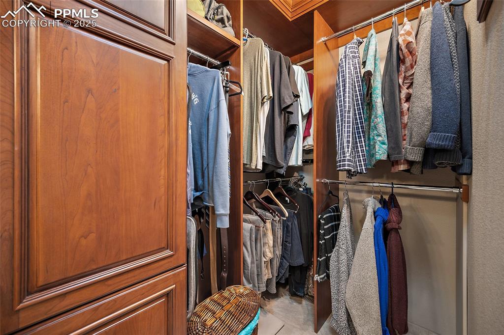 Image 22 of 49: Custom closet design with solid cherry cabinets 