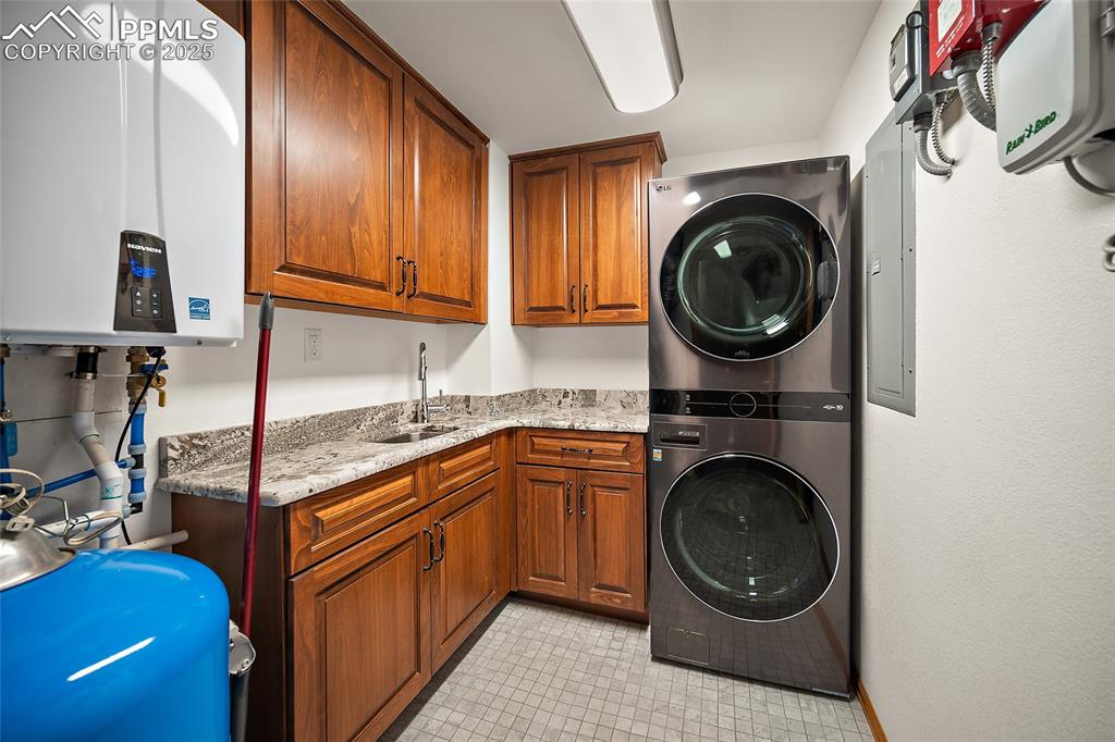 Image 27 of 49: Tankless water heater and utility sink