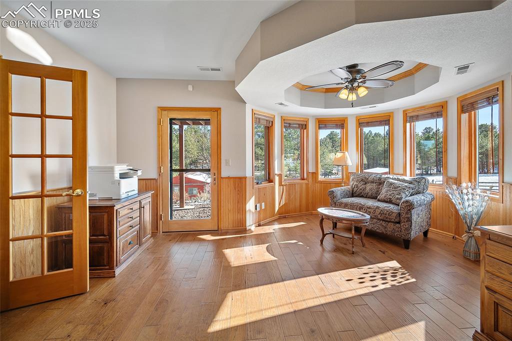 Image 31 of 49: Expansive windows to take in the serene views with walkout to lower patio 