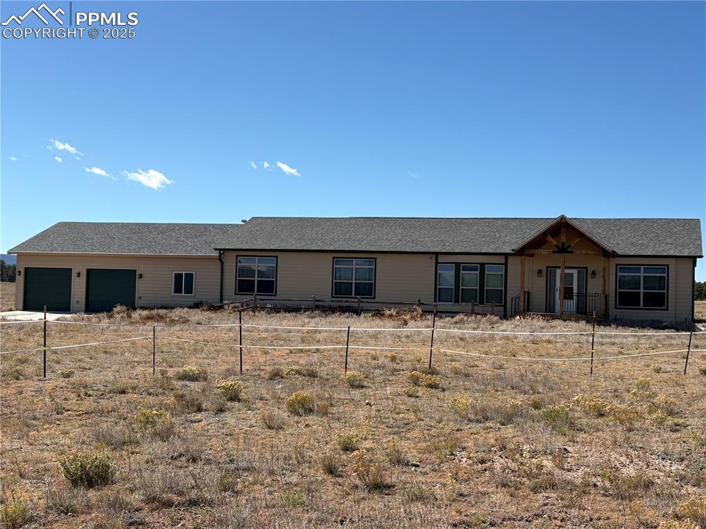 Image 1 of 31: Ranch-style home featuring a shingled roof and a porch