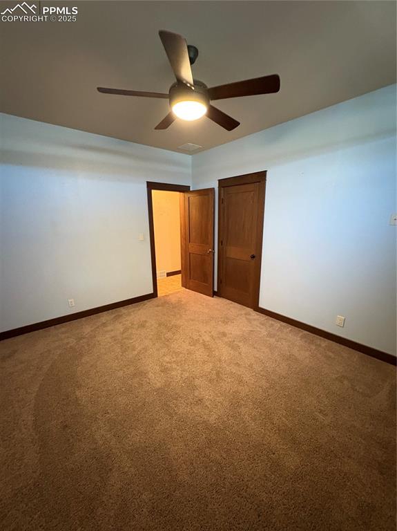 Image 14 of 31: Unfurnished bedroom featuring carpet and ceiling fan