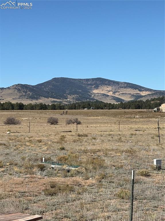 Image 32 of 32: View of mountain backdrop with rural landscape
