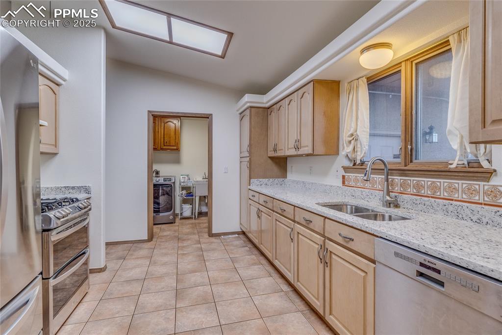 Image 13 of 48: Kitchen with tile floors/new granite counter tops - straight ahead is the l