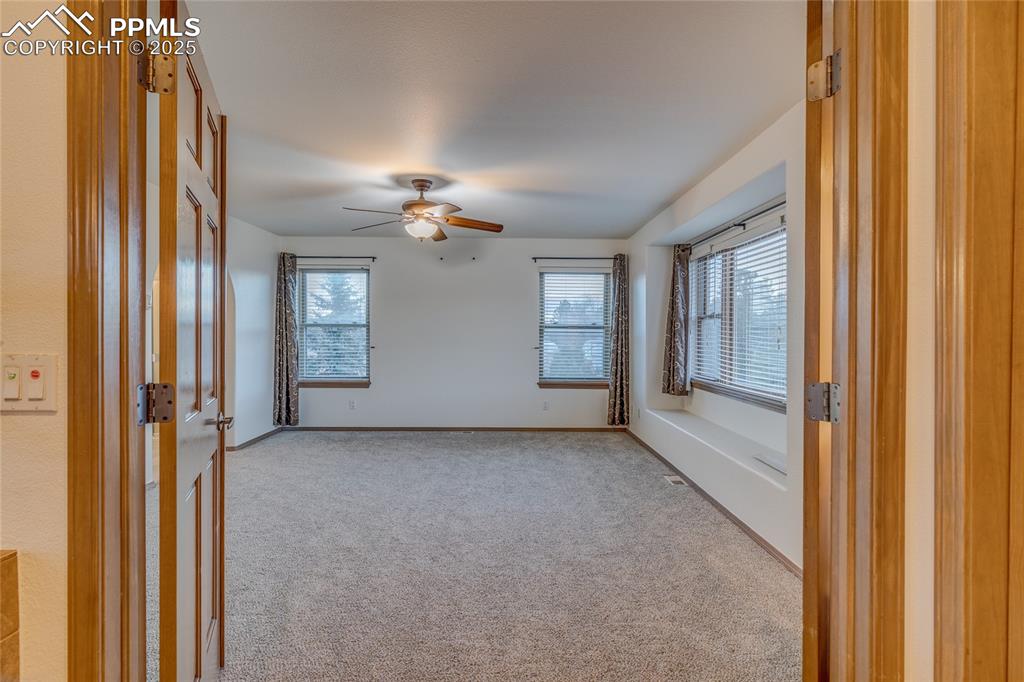 Image 19 of 48: Double door entry to primary bedroom