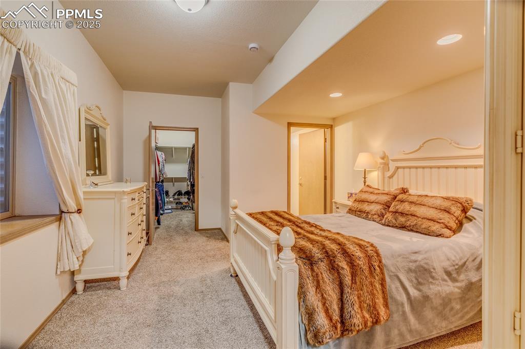 Image 36 of 48: Secondary suite with walk in closet and full bathroom 