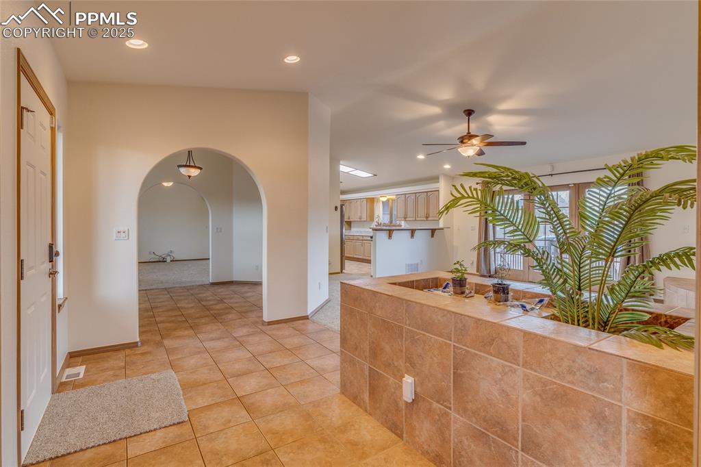 Image 7 of 48: From double door entry to primary bedroom looking toward dining room - kitc