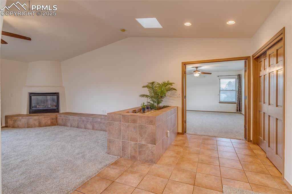 Image 8 of 48: From dining room looking toward primary bedroom entry and family room with 