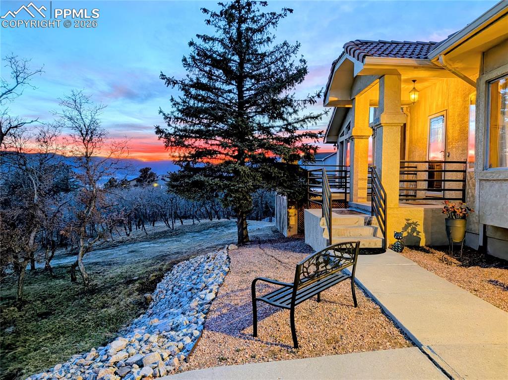 Image 2 of 39: Sunset view from the front of the house