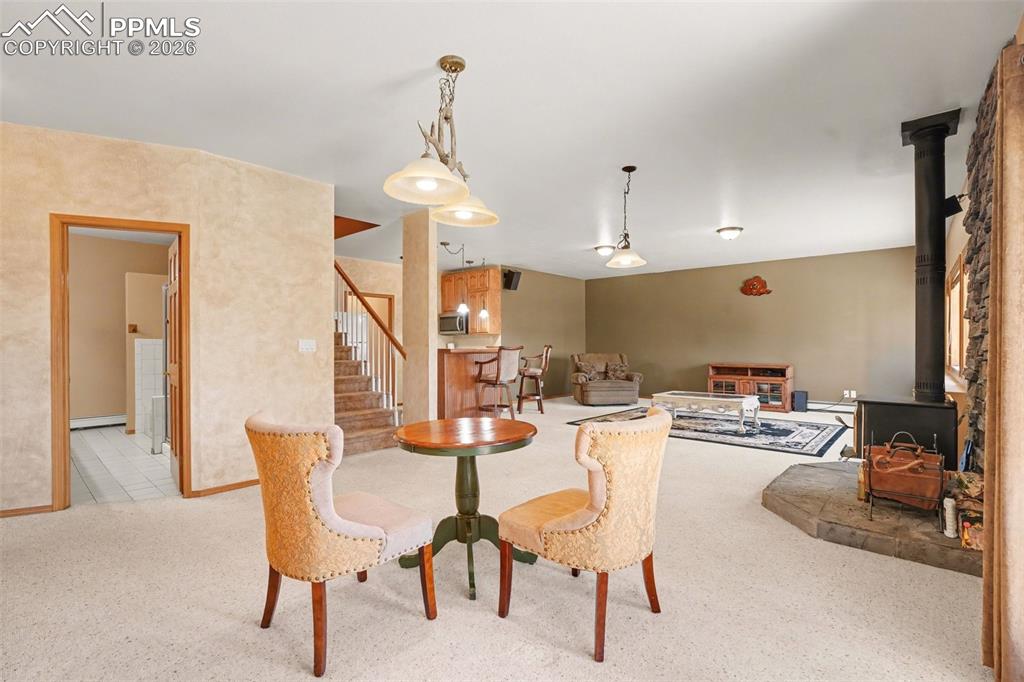 Image 31 of 39: Looking from the walk-out into the basement.