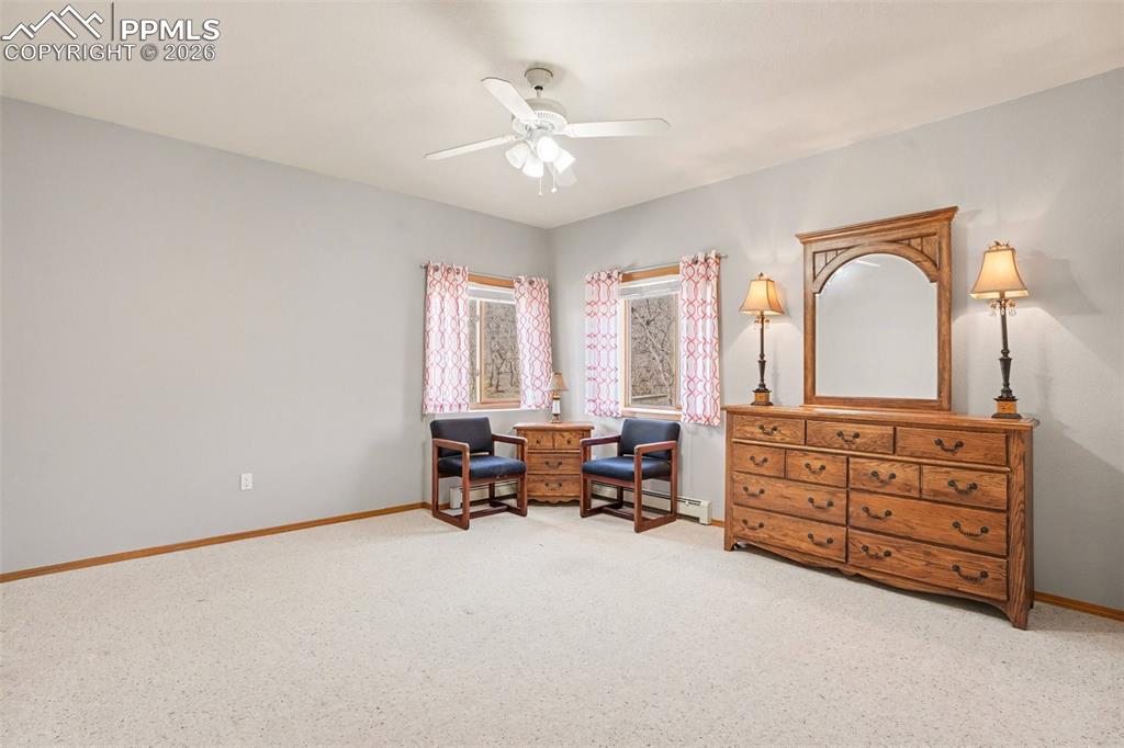 Image 35 of 39: Another basement bedroom has room for a king-size bed.