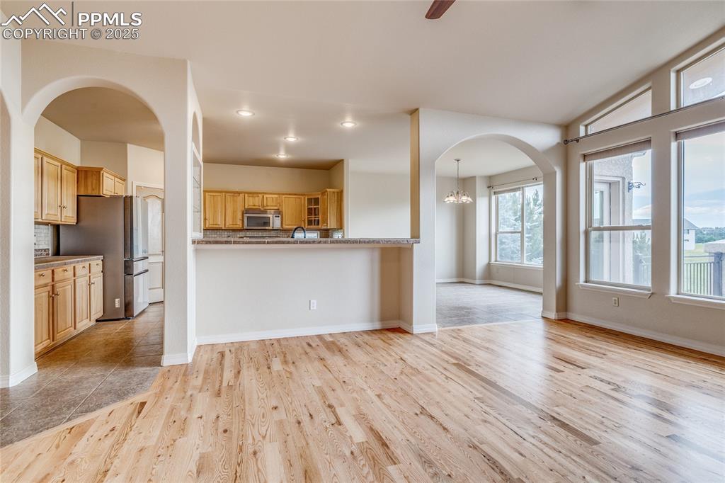 Image 13 of 48: From living room, looking toward kitchen and dining room