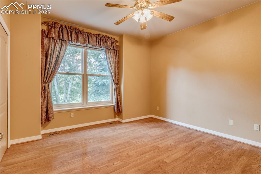 Image 21 of 48: Bedroom/Office at front entry 