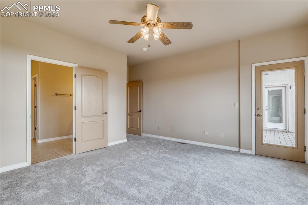 Image 26 of 48: Master bedroom with walk out to back deck