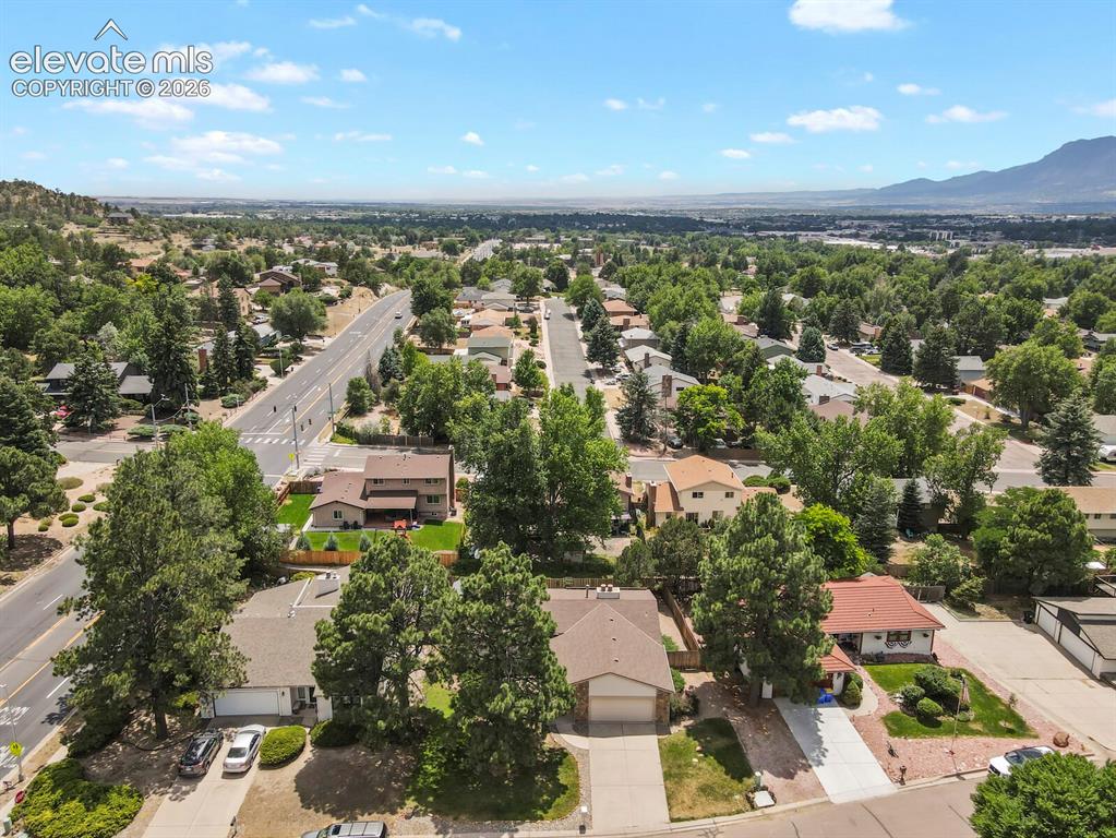 Image 45 of 50: Expansive neighborhood setting featuring mature trees, residential streets,