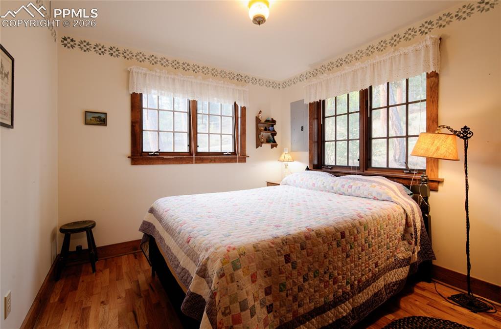 Image 15 of 33: Bright and cheery guest bedroom