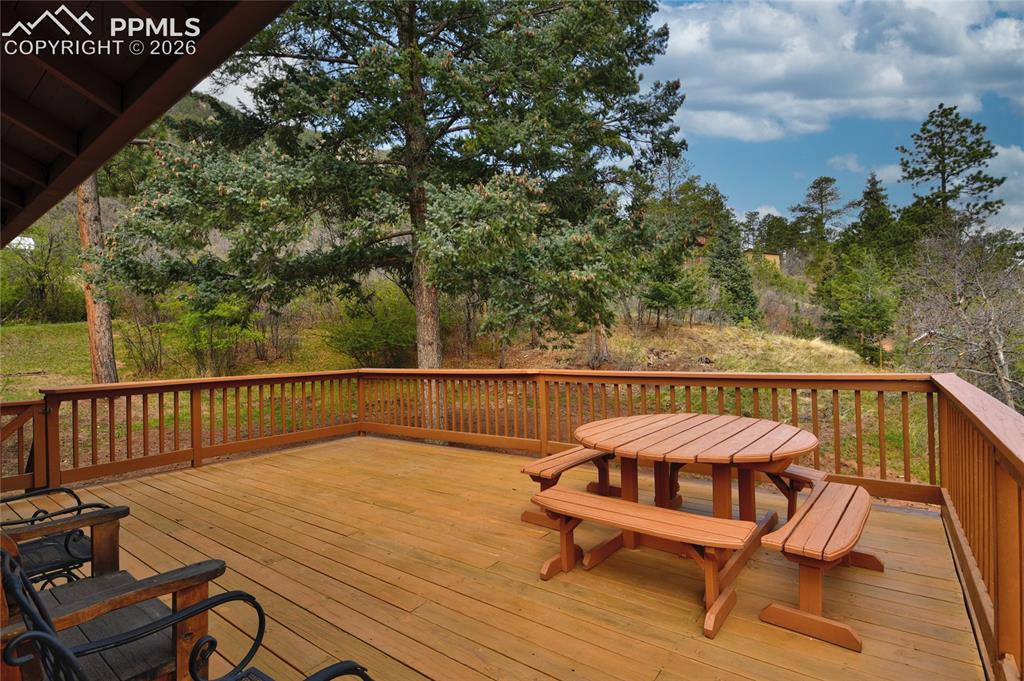 Image 20 of 33: Perfect deck for relaxing in the sun and it could hold a great group for th