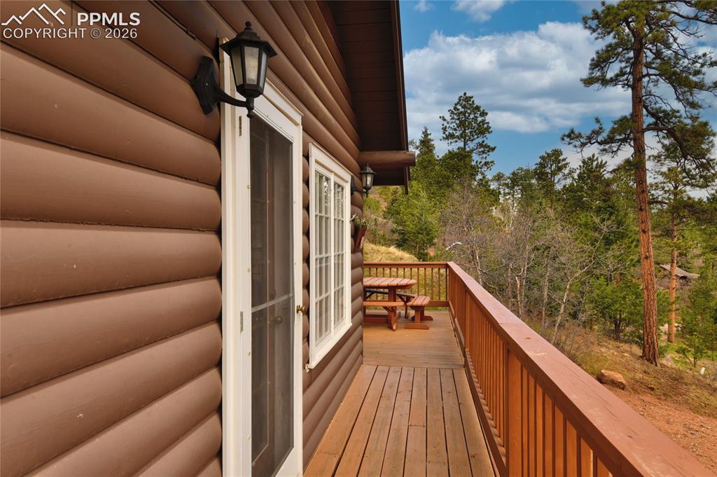 Image 3 of 33: front door leads to a wonderful large deck