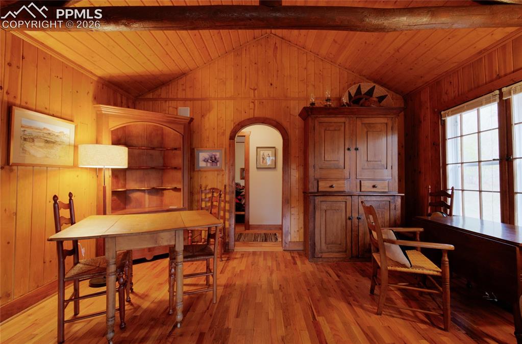 Image 6 of 33: Living room with hall way leading to two different bedrooms