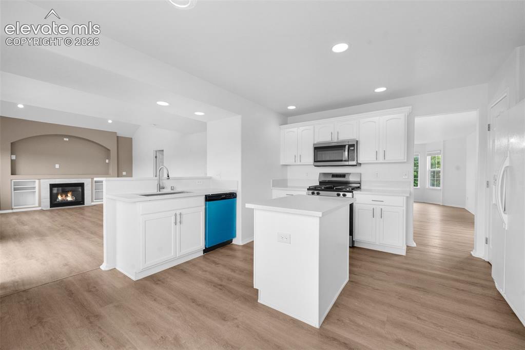 Image 11 of 35: Open into the end of the family room