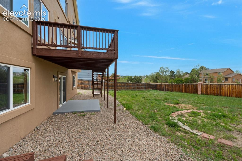 Image 31 of 35: Expansive outdoor deck featuring wood-finish flooring and full perimeter ra