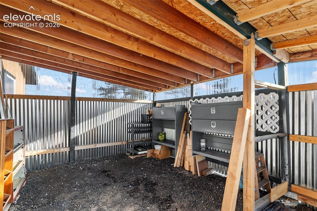 Image 33 of 50: Carport area attached to the studio